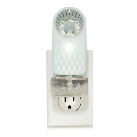 scentplug fan with diamond fade pattern and light with scentplug refill in outlet