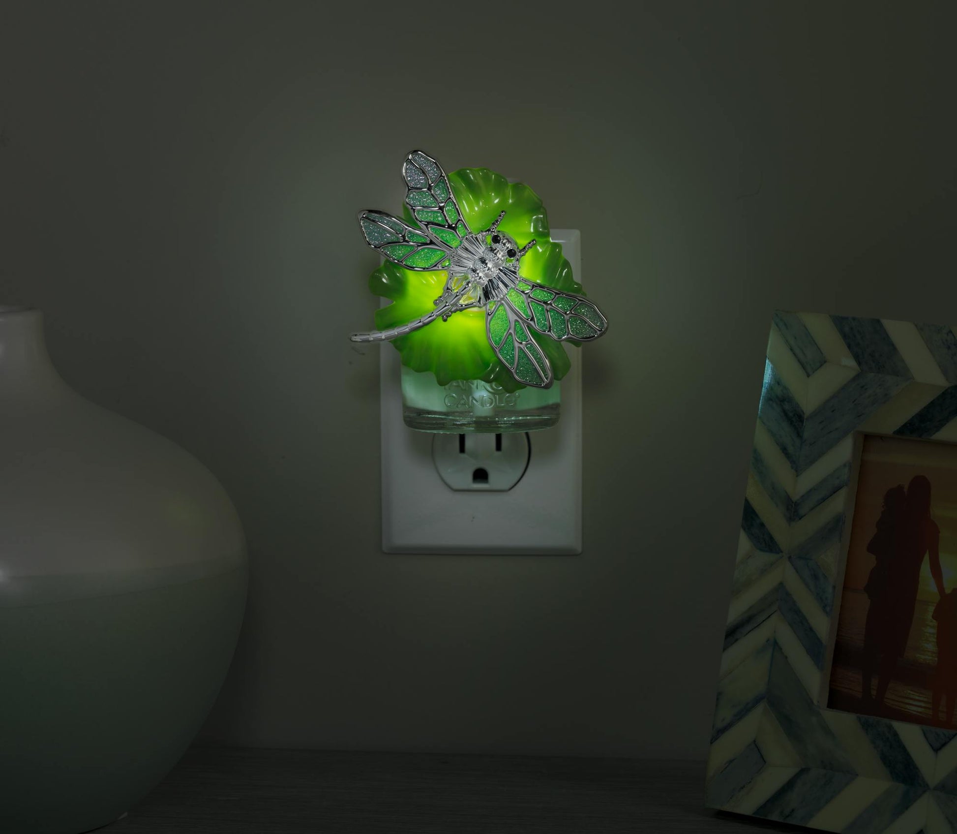 dragonfly on lilypad with light scentplug diffusers in socket