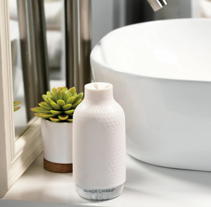 clean cotton fragrance dispenser on table