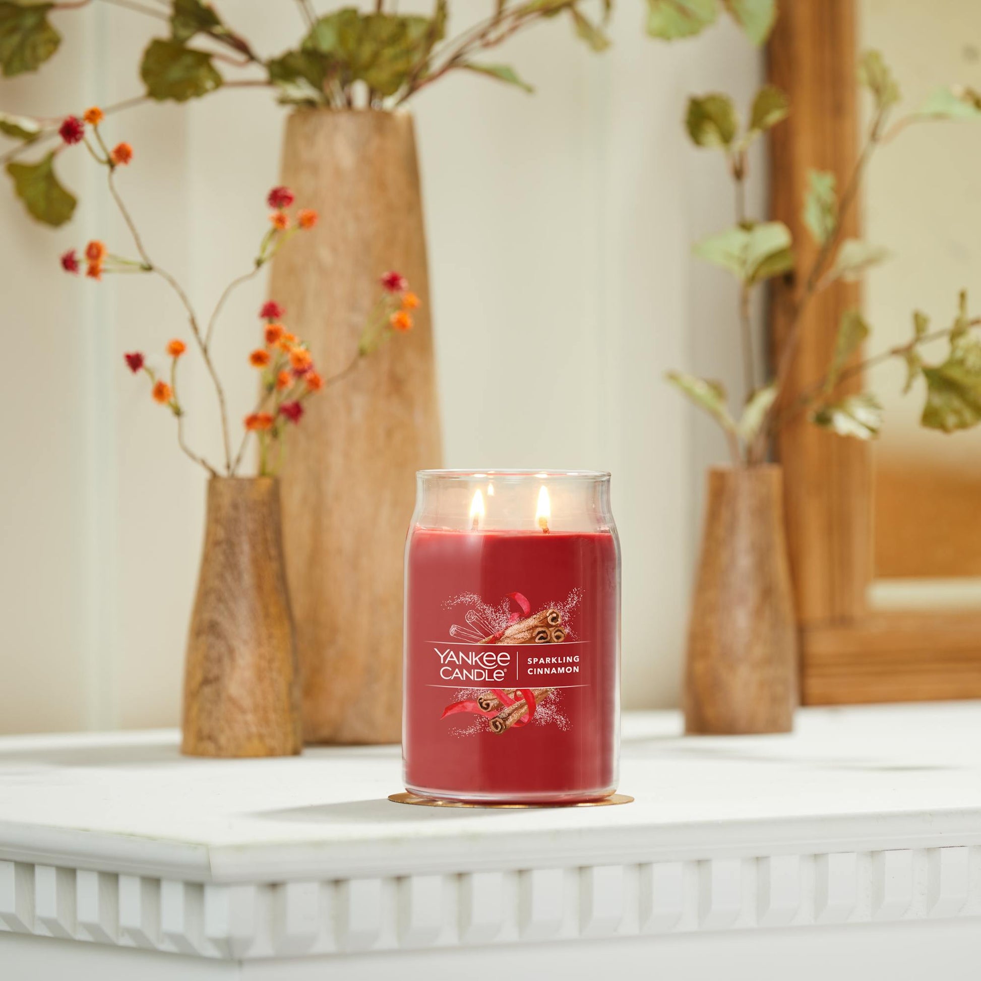 sparkling cinnamon signature large jar candle on mantle