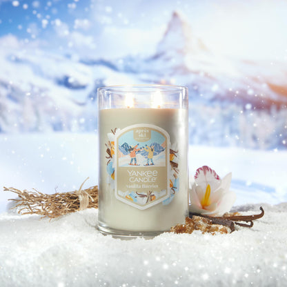 Apres Ski Collection Vanilla Flurries Signature Large Tumbler Candle in snow surrounded by mountains, vanilla, and a flower