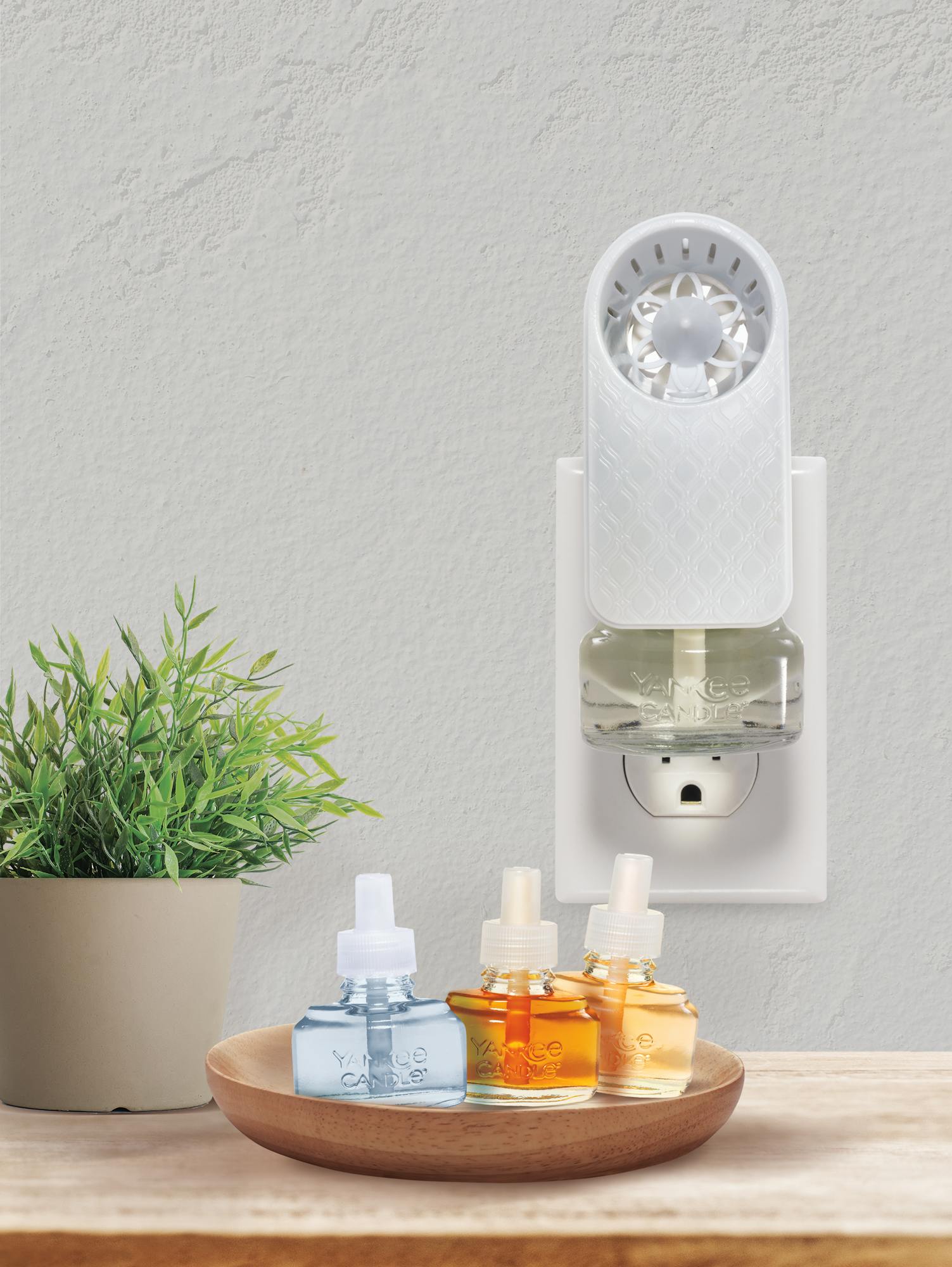 moroccan scentplug fans in socket with range of scent refills