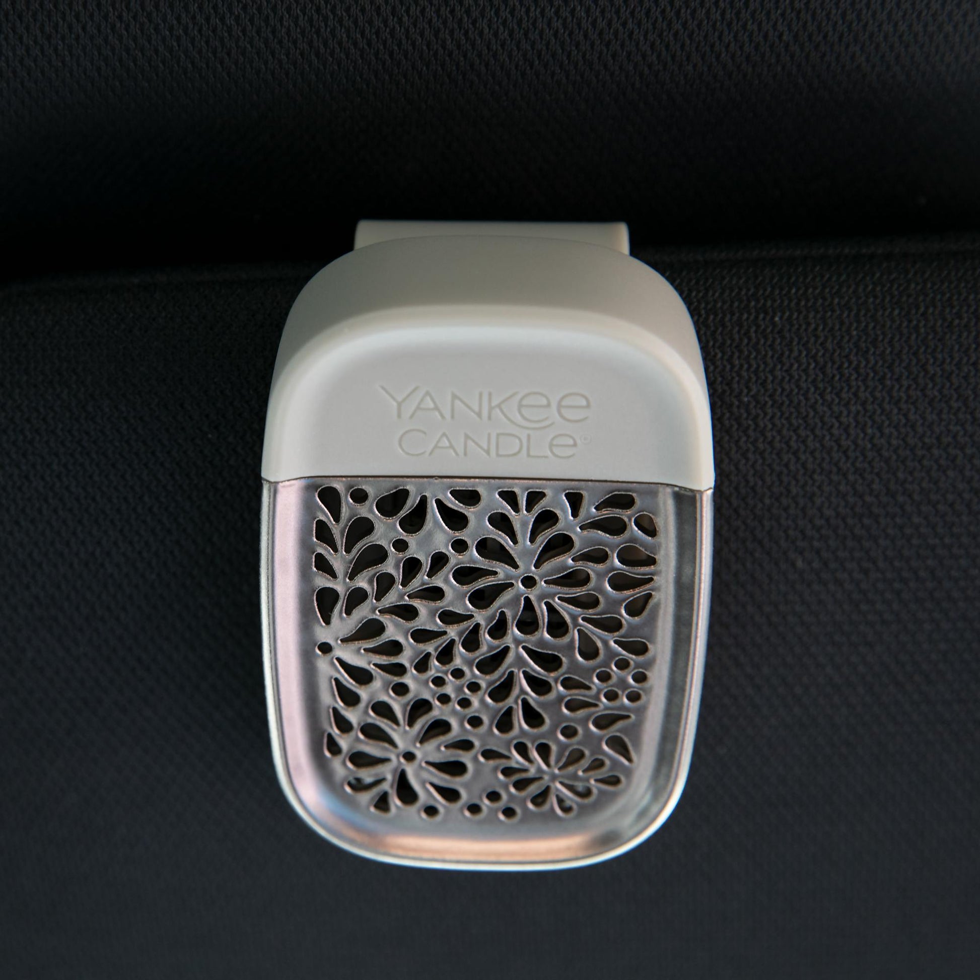 sidekick visor clip in nickel leaf pattern attached to car visor