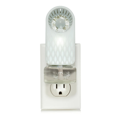 scentplug fan with diamond fade pattern and light with scentplug refill in outlet